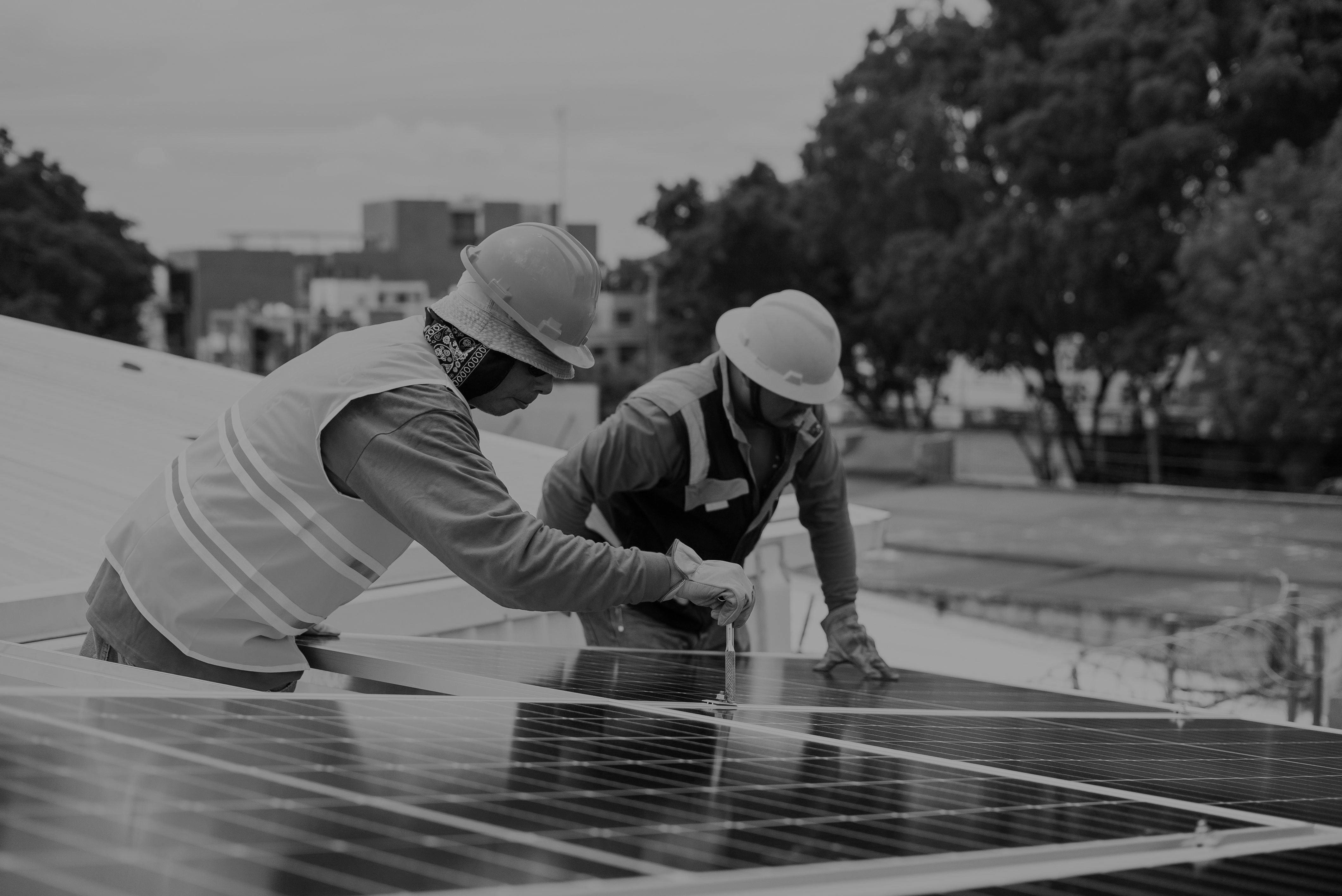 Solar installers working on a rooftop array